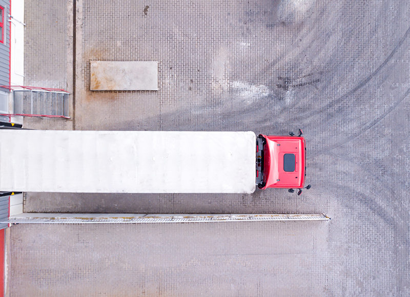 Aerial View of Loading Warehouse with Semi Truck. Aerial